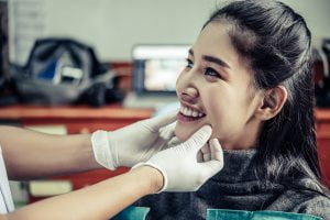 person at the dentist getting examined