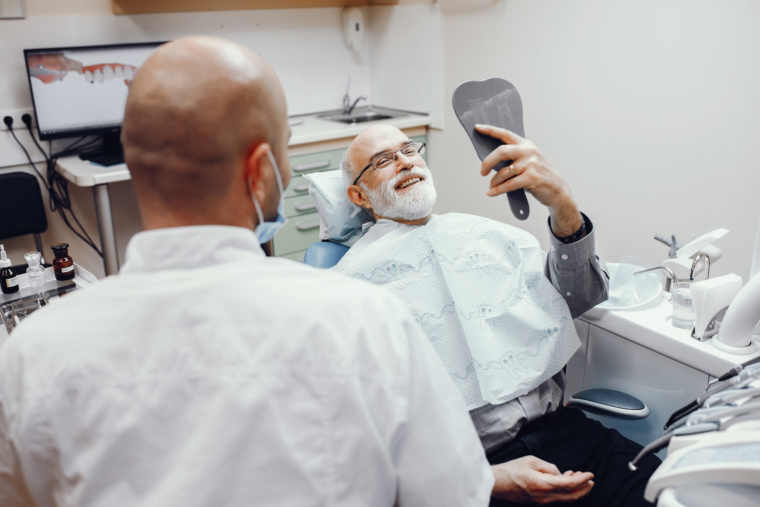 old person sitting in a dental clinic